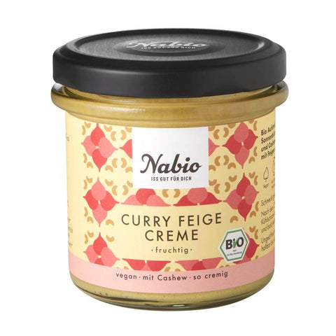 Glas mit Cashew Curry Feige Creme, eine cremige Mischung aus Cashewnüssen, Curry und Feigen, ideal als Brotaufstrich oder Dip.