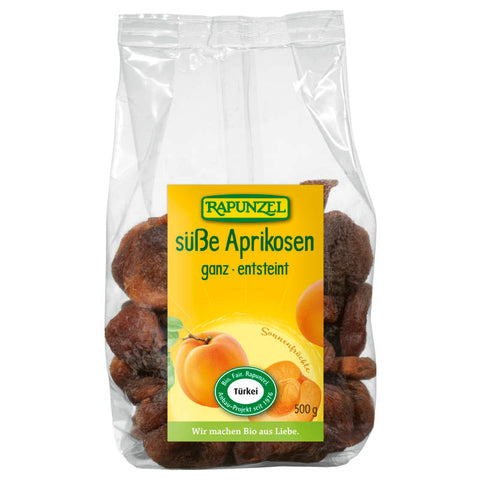 Eine Packung süßer, ganz entsteinter Aprikosen, die frisch und saftig aussehen.