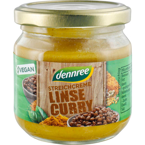 Ein Glas Streichcreme Linse-Curry mit einer cremigen, gelblichen Textur, verfeinert mit Linsen und aromatischen Curry-Gewürzen. Perfekt als Brotaufstrich oder Dip.