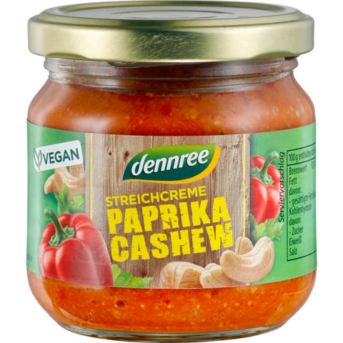 Glas mit Streichcreme Paprika-Cashew, eine vegane und cremige Aufstrich-Option mit Paprika und Cashew-Nüssen, ideal für Brot und Cracker.