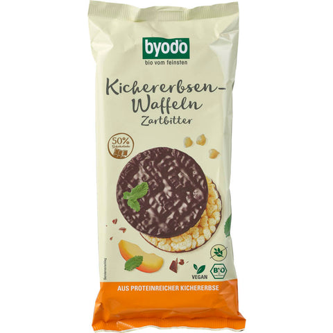 Eine Packung Kichererbsen-Waffeln mit Zartbitterschokolade, knusprige Waffeln aus Kichererbsenmehl, überzogen mit feiner Zartbitterschokolade, ideal für einen gesunden Snack oder als süße Leckerei zwischendurch.