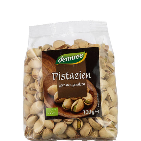 Geröstete Pistazien mit Schale in einer Schale, perfekt als gesunder Snack oder zum Verfeinern von Gerichten.