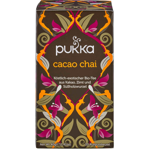 Eine Packung Cacao Chai Tee, eine aromatische Mischung aus reichhaltigem Kakao und exotischen Chai-Gewürzen, präsentiert in einer stilvollen, umweltfreundlichen Verpackung.