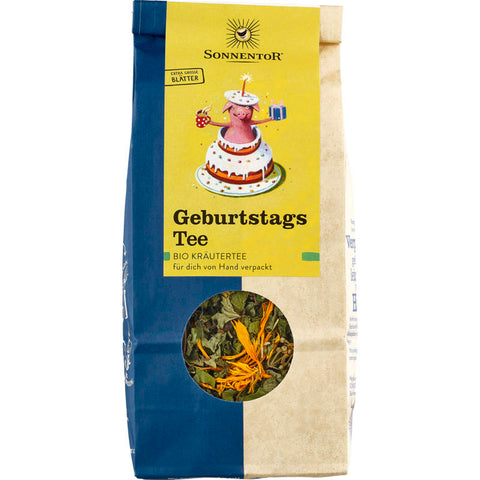 Eine stilvolle Verpackung mit Geburtstagstee, verziert mit bunten Ballons und festlichen Motiven. Perfekt als Geschenk für Teeliebhaber, um besondere Geburtstagsmomente zu feiern.