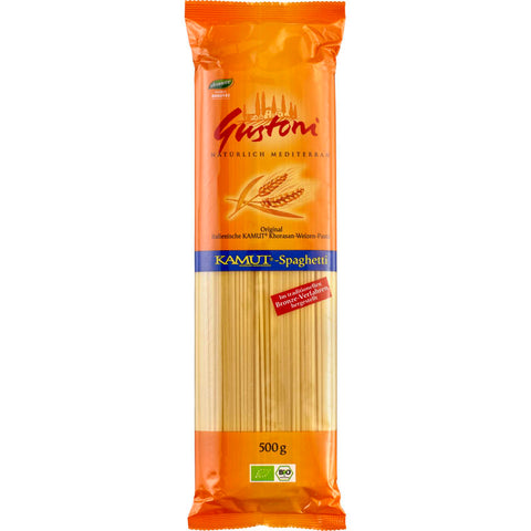 Eine Packung ungekochter Spaghetti-Nudeln, ordentlich gebündelt und bereit zum Kochen.