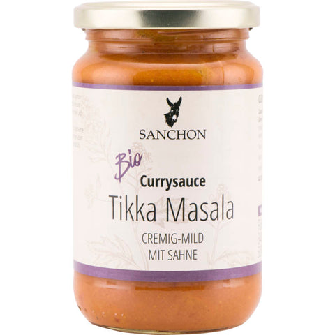 Currysauce Tikka Masala in einem Glasbehälter mit rotem Etikett, verziert mit traditionellen indischen Mustern und Schriftzügen. Perfekt für die Zubereitung authentischer indischer Gerichte.