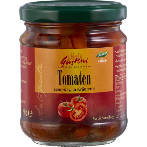 Ein Glas mit halbgetrockneten Tomaten in aromatischem Kräuteröl. Die Tomaten sind saftig und reich an Geschmack, perfekt für Salate, Pasta oder als Antipasti.