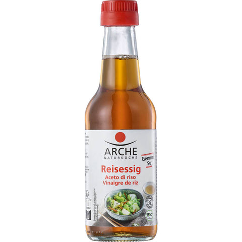 Eine Flasche klarer Reisessig mit einem Etikett in japanischer Schrift, ideal zum Würzen von Sushi, Salaten und asiatischen Gerichten.