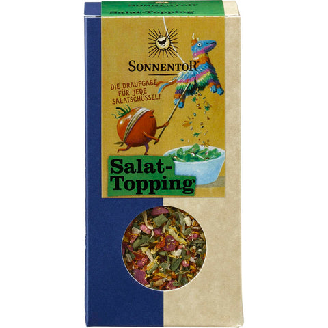 Salattopping Gewürzzubereitung in einer transparenten Gewürzdose, gefüllt mit einer bunten Mischung aus getrockneten Kräutern und Gewürzen, ideal zum Verfeinern von Salaten und anderen Gerichten.