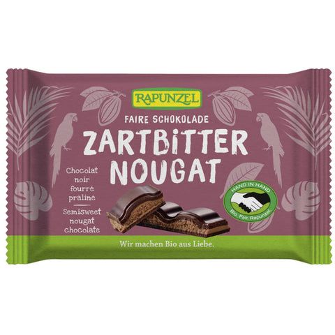 Eine Tafel Zartbitter Nougat Schokolade, verpackt in einer eleganten, dunkelbraunen Verpackung mit goldenen Akzenten.