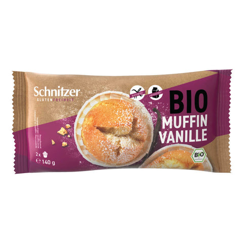 Glutenfreier Vanille-Muffin, frisch gebacken und goldbraun, auf einem weißen Teller serviert.