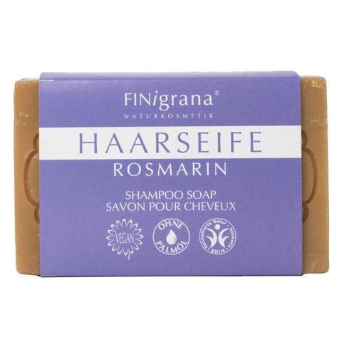 Handgemachte Haarseife mit Rosmarin, ideal für die natürliche Haarpflege, in umweltfreundlicher Verpackung.